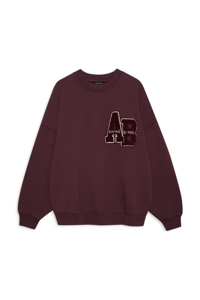 Maroon sweatshirt with an Anine Bing AB ogo on a white background