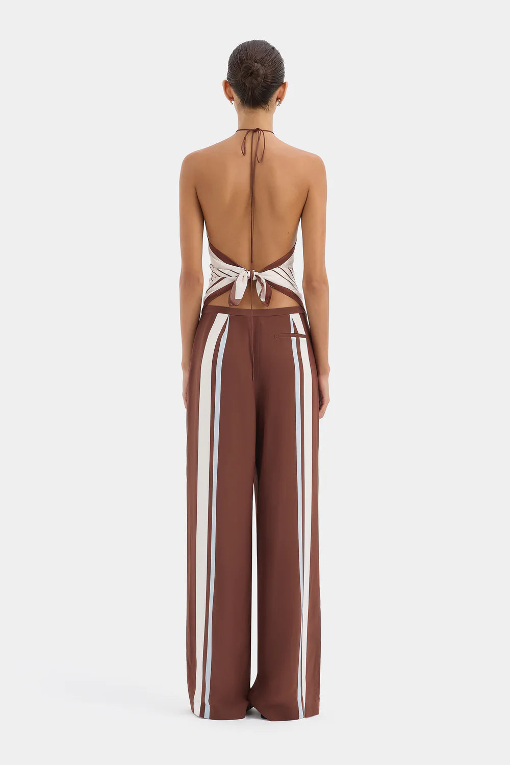 Brown jumpsuit with white stripes on a white background