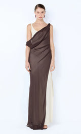 Woman wearing a brown draped evening gown on a white background