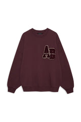 Maroon sweatshirt with an Anine Bing AB ogo on a white background