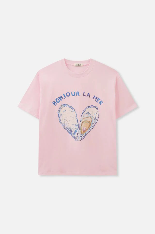 Pink t-shirt with 'Bonjour La Mer' design featuring shells on a white background
