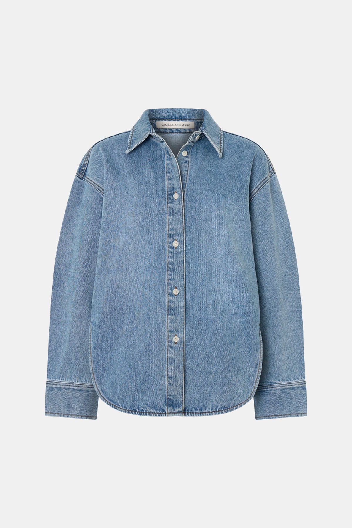 A light blue denim button-up shirt with a pointed collar and long sleeves, shown flat against a light gray background.
