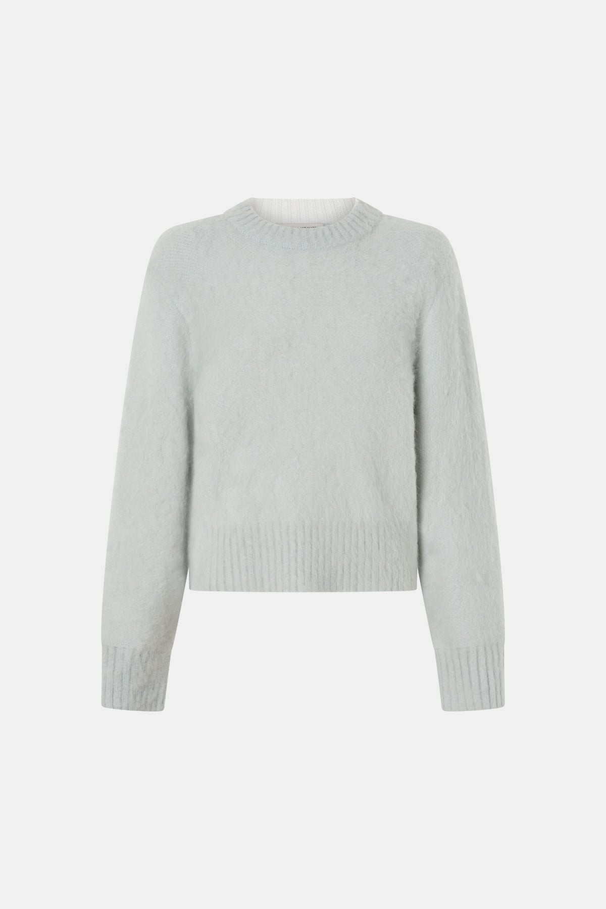 Light mint sweater on a white background