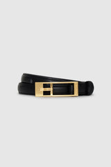 A black leather belt with a polished gold-tone metal buckle, displayed on a light gray background.