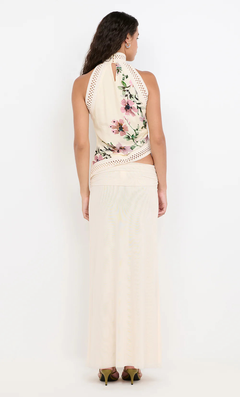 A woman standing in a white skirt. Eva Maxi Skirt in Snow.&nbsp;A sophisticated mesh maxi skirt perfect for evening events, cocktail parties or date nights.