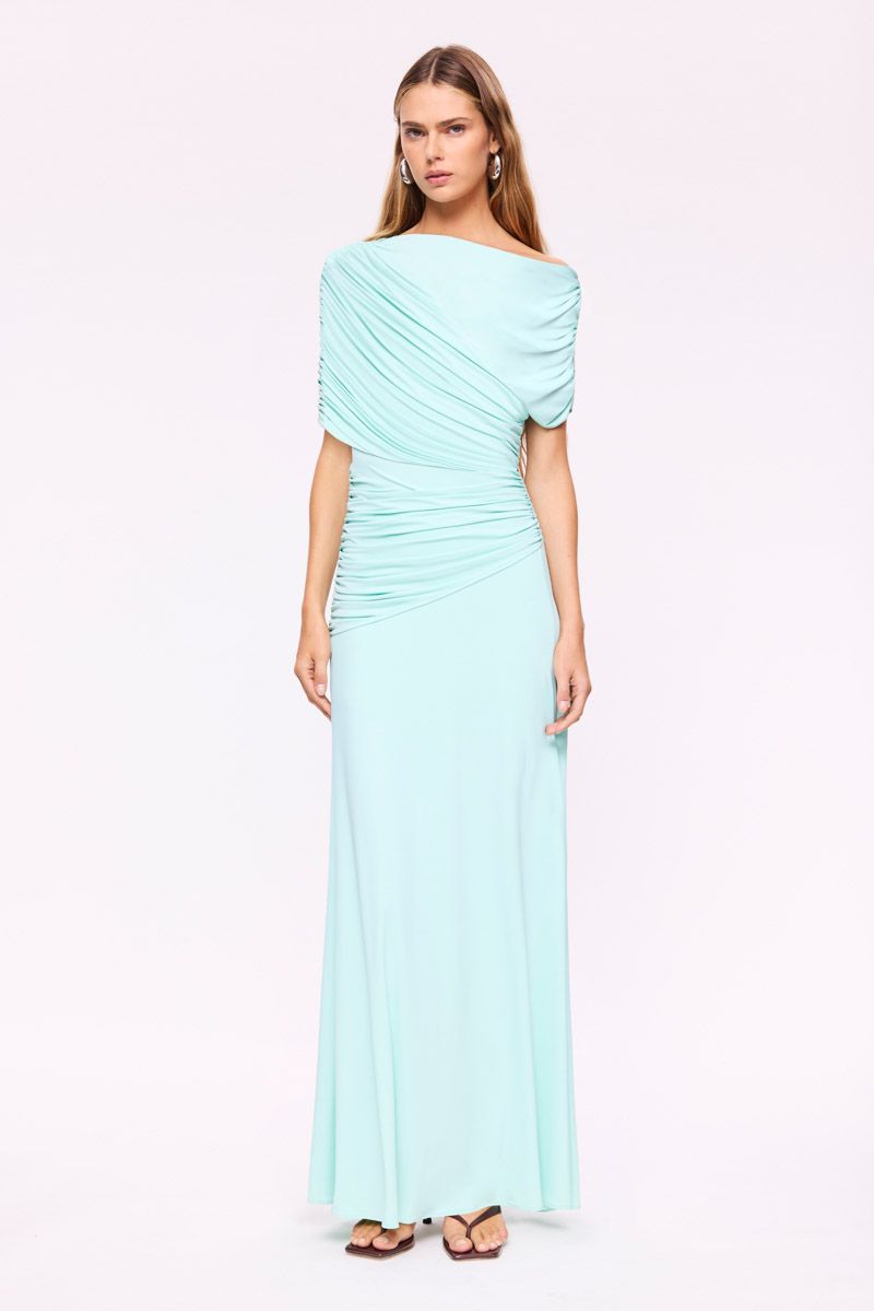 Woman wearing a Mint Draped maxi dress on a white background