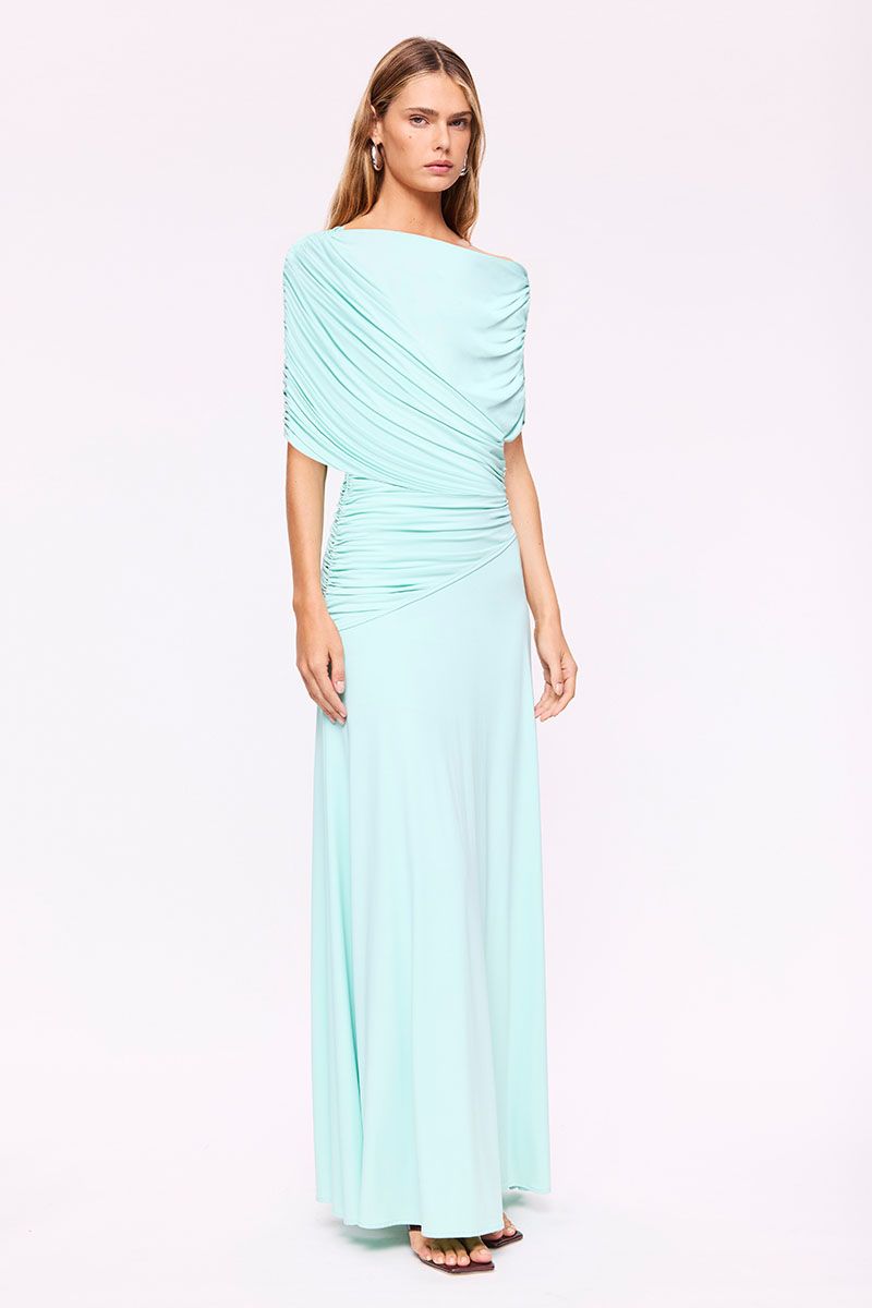 Woman wearing a Mint Draped maxi dress on a white background