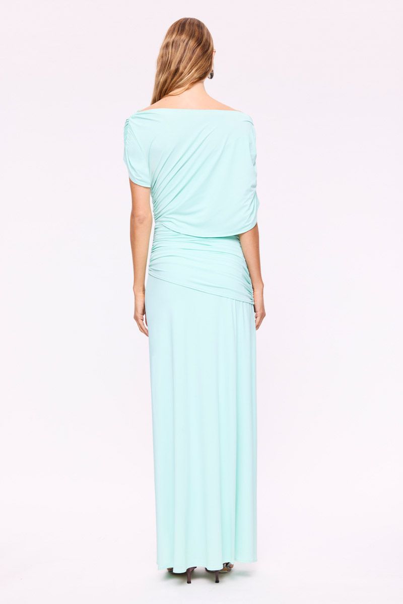 Woman wearing a Mint Draped maxi dress on a white background