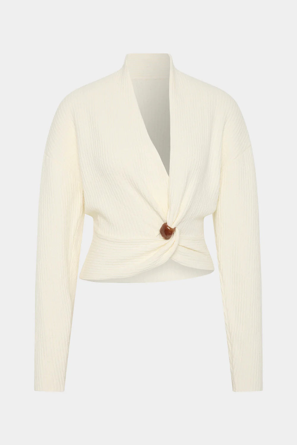 Cream-colored knit cardigan with a button on a white background