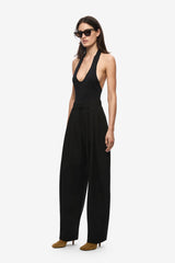 Woman wearing a black trousers on a white background