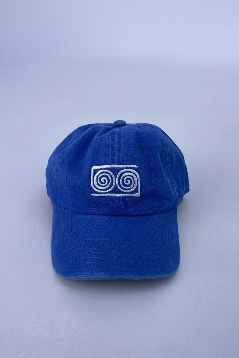 Blue cap with a white logo on a light gray background