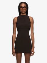 Woman wearing a Espresso sleeveless dress on a white background
