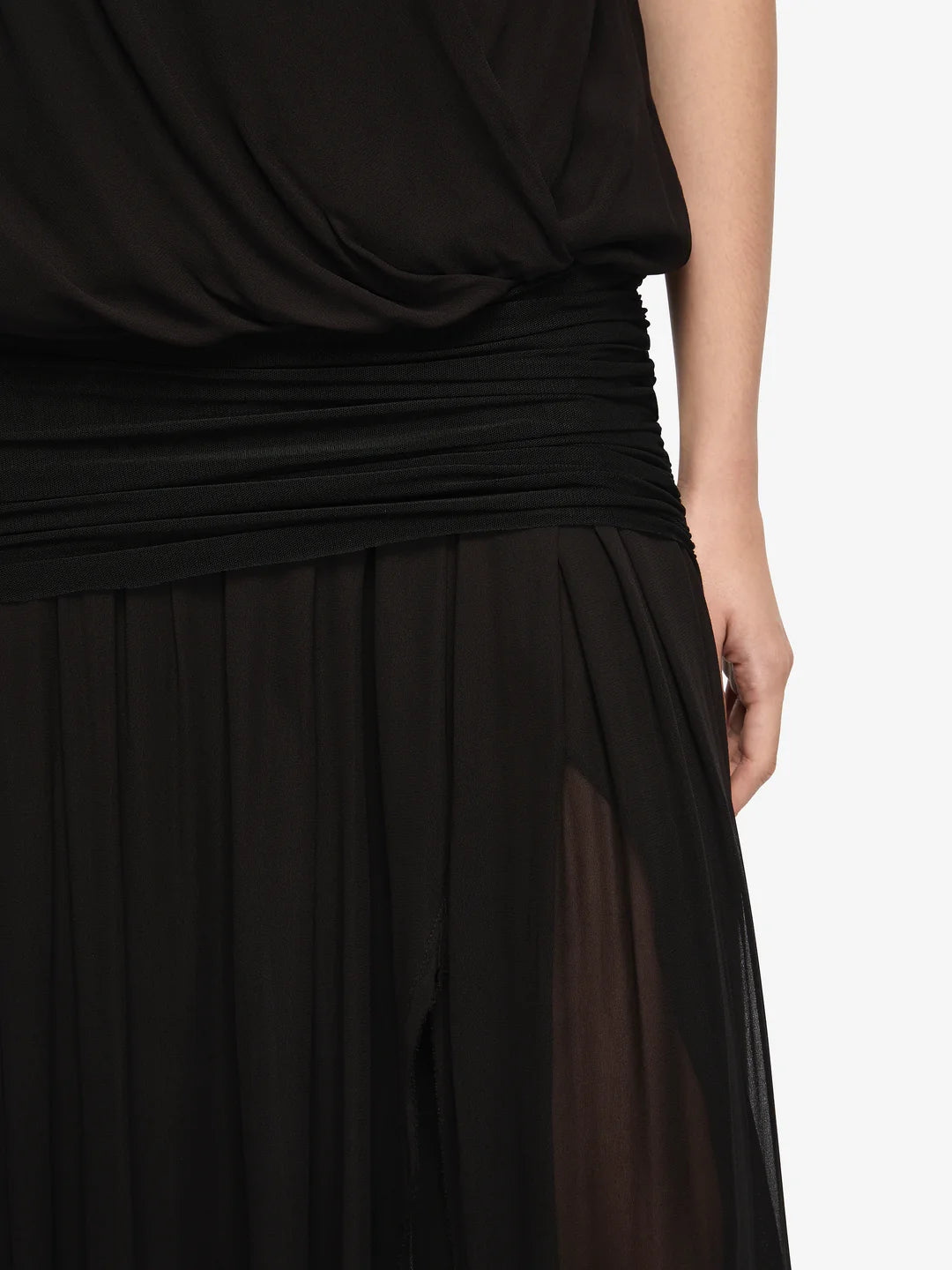 Black draped dress on a white background