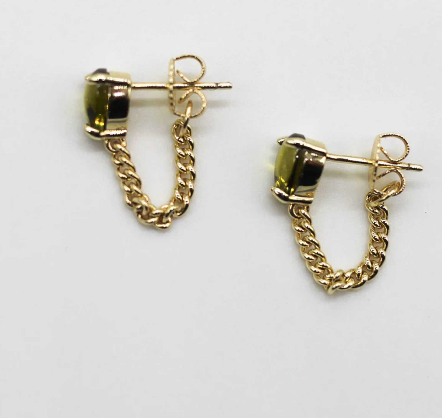 Gold chain hoop earrings on a white background