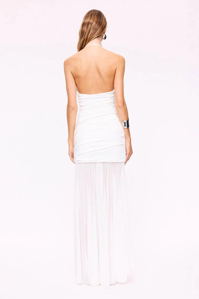 Woman wearing a strapless white dress on a white background